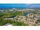 Aerial view showing condo community near a lake and other amenities at 4250 Players Pl # 2625, Sarasota, FL 34238