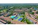 Aerial view of community with pool and tennis courts at 4250 Players Pl # 2625, Sarasota, FL 34238