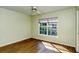 Bedroom with wood floors and large window at 4250 Players Pl # 2625, Sarasota, FL 34238