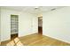 Bright bedroom with wood flooring and closet at 4250 Players Pl # 2625, Sarasota, FL 34238