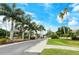 Community entrance with palm trees and the Pinestone sign at 4250 Players Pl # 2625, Sarasota, FL 34238