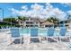 Inviting pool area with numerous lounge chairs for relaxation at 4250 Players Pl # 2625, Sarasota, FL 34238