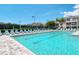 Refreshing community pool with plenty of lounge chairs at 4250 Players Pl # 2625, Sarasota, FL 34238