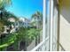 View from condo balcony showing lush landscaping and other buildings at 4250 Players Pl # 2625, Sarasota, FL 34238