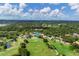 Aerial view of community golf course and clubhouse at 4402 Weybridge St # 95, Sarasota, FL 34235