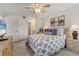 Main bedroom with a king-size bed and adjacent bathroom at 4402 Weybridge St # 95, Sarasota, FL 34235