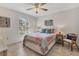 Bright bedroom with tiled floor and window seating at 4402 Weybridge St # 95, Sarasota, FL 34235