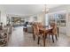 Charming dining room featuring a wood table and four patterned chairs at 4402 Weybridge St # 95, Sarasota, FL 34235