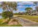 Golf course path with scenic views and lush landscaping at 4402 Weybridge St # 95, Sarasota, FL 34235