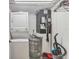 Laundry closet with washer, dryer, and water heater at 4402 Weybridge St # 95, Sarasota, FL 34235