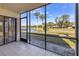 Screened-in porch overlooking golf course and water views at 4402 Weybridge St # 95, Sarasota, FL 34235