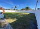 Large grassy backyard with white vinyl fence at 4609 19Th W St, Bradenton, FL 34207