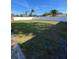 Large grassy backyard with white vinyl fence at 4609 19Th W St, Bradenton, FL 34207