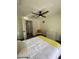 Comfortable bedroom with a queen bed and ceiling fan at 4609 19Th W St, Bradenton, FL 34207