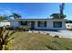 Charming ranch home with teal accents and landscaped lawn at 4609 19Th W St, Bradenton, FL 34207