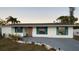 Newly renovated single story home with teal shutters and landscaping at 4609 19Th W St, Bradenton, FL 34207