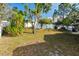 Large backyard with grassy area and trees at 4927 69Th E Ct, Palmetto, FL 34221