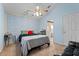 Bright bedroom with a comfortable bed and ceiling fan at 4927 69Th E Ct, Palmetto, FL 34221