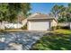 House exterior with driveway and landscaping at 4927 69Th E Ct, Palmetto, FL 34221