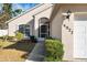 Front entrance with walkway, landscaping, and screened door at 4927 69Th E Ct, Palmetto, FL 34221