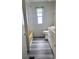 Bathroom with gray flooring, a bathtub, and a toilet at 4969 Pebble Beach Ave, Sarasota, FL 34234