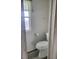 Clean bathroom with toilet and grey flooring at 4969 Pebble Beach Ave, Sarasota, FL 34234