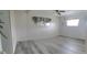 Spacious bedroom with gray flooring and ceiling fan at 4969 Pebble Beach Ave, Sarasota, FL 34234