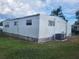 Single wide mobile home with a large yard at 4969 Pebble Beach Ave, Sarasota, FL 34234