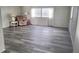 Living room with gray flooring and large windows at 4969 Pebble Beach Ave, Sarasota, FL 34234