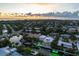 Aerial sunset view of a waterfront home with a private pool and boat dock at 505 69Th St, Holmes Beach, FL 34217