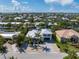 Aerial view of a waterfront home with a private dock and pool at 505 69Th St, Holmes Beach, FL 34217