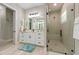 Elegant bathroom with white cabinets, quartz countertops, and a large glass shower at 505 69Th St, Holmes Beach, FL 34217