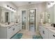 Spacious bathroom with double vanity, marble countertops, and access to bedroom at 505 69Th St, Holmes Beach, FL 34217