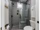 Modern bathroom with gray tile shower and glass enclosure at 505 69Th St, Holmes Beach, FL 34217