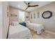 Guest bedroom with twin beds, decorative wall art and ample natural light at 505 69Th St, Holmes Beach, FL 34217