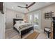 Bright bedroom with a queen-size bed and private access to a balcony at 505 69Th St, Holmes Beach, FL 34217