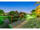 Night view of a canal with a private dock and boat at 505 69Th St, Holmes Beach, FL 34217