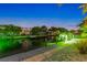 Scenic view of canal with private dock and boat at night at 505 69Th St, Holmes Beach, FL 34217