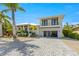 Two-story home with a modern design, two-car garage, and landscaped yard at 505 69Th St, Holmes Beach, FL 34217