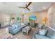 Spacious living area featuring comfortable seating and a large TV at 505 69Th St, Holmes Beach, FL 34217