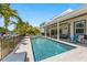 Large pool with spacious patio and canal views at 505 69Th St, Holmes Beach, FL 34217