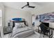 Bright bedroom with a built-in workspace and surfboard decor at 5204 Title Row Dr, Bradenton, FL 34210