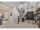 Elegant two-story entryway with staircase, chandelier, and built-in shelving at 5204 Title Row Dr, Bradenton, FL 34210