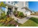 Landscaped entry with stone walkway leading to a two-story home at 5204 Title Row Dr, Bradenton, FL 34210