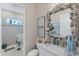 Powder room with seashell mirror, sink, and coastal themed decor at 5204 Title Row Dr, Bradenton, FL 34210