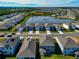 Aerial view of a house near a lake in a residential area at 5216 Adega Way, Bradenton, FL 34211