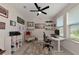 Modern home office featuring a desk, chair, and ceiling fan at 5216 Adega Way, Bradenton, FL 34211