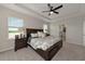 Spacious main bedroom with king-size bed and ensuite bathroom at 5216 Adega Way, Bradenton, FL 34211