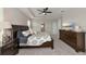 Main bedroom with king-size bed and large dresser at 5216 Adega Way, Bradenton, FL 34211