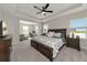 Large main bedroom with king-size bed and sitting area at 5216 Adega Way, Bradenton, FL 34211